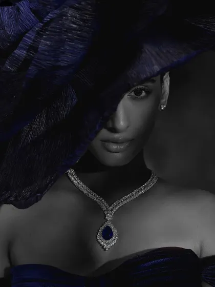 A color-selective black and white image for Purab Paschim, where only the blue sapphire of the necklace is in color, creating a striking focal point.