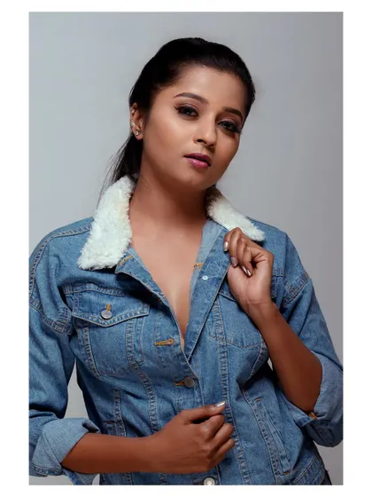 A modern take on a classic denim jacket look. The styling and pose are inspired by iconic, strong female characters, creating a portrait that is both sensual and independent.
