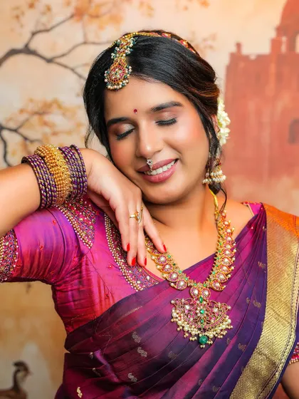 A serene and beautiful shot of Anjana. The soft, closed-eye pose highlights the flawless eye makeup and the overall peaceful vibe of the photoshoot.