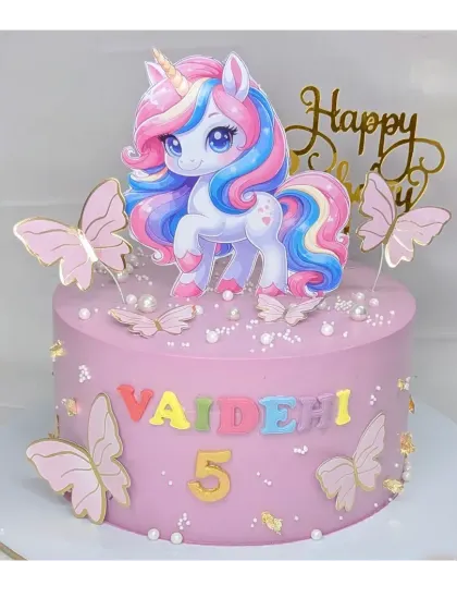 A magical unicorn cake for Vaidehi's 5th birthday. This fresh pineapple cake has a simple design with a cute unicorn and butterfly toppers.