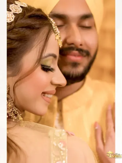 An intimate close-up of the couple during their Haldi ceremony, capturing their loving expressions.