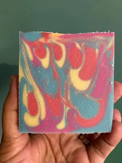 Look at the vibrant swirls in this bar! Each soap is made with a blend of nourishing oils like coconut, olive, and sunflower, plus rich butters like shea or kokum.