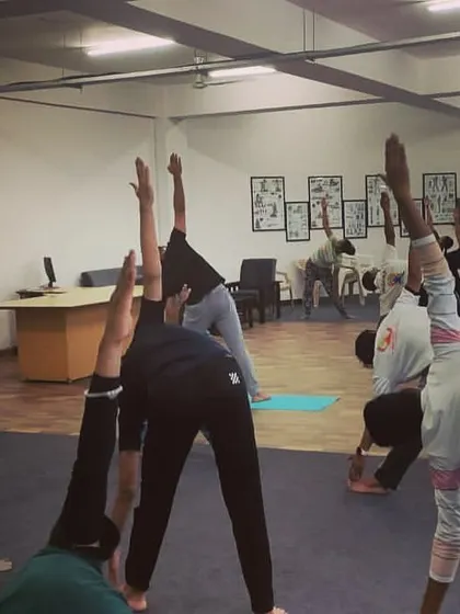 Group yoga sessions foster a sense of community and shared purpose. Here, our athletes work on poses that build both physical and mental endurance.