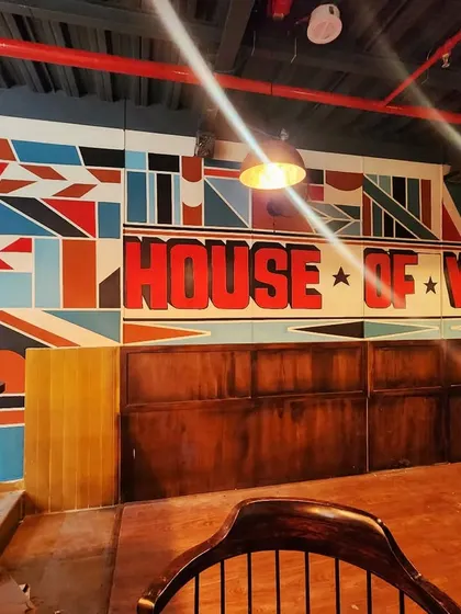 Another angle of the geometric pattern wall, showing how the different shapes and colors come together to create a cohesive, energetic piece.