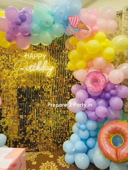 These Candyland theme close-ups show the fun details, including the neon "Happy Birthday" sign and the variety of candy and dessert-themed props that make the party extra sweet.