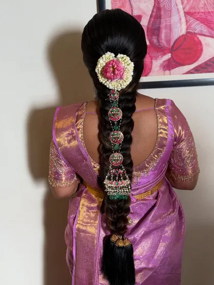 A closer look at the stunning temple jewellery on the braid. Each piece is carefully placed to create a look of divine elegance for the mother-to-be.