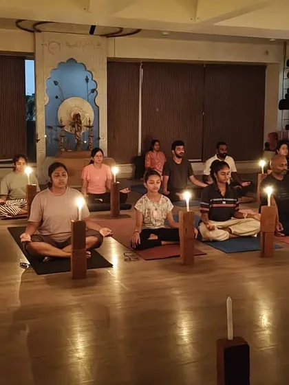 The serene atmosphere of our Tratak Kriya session. The room is filled with focused energy as students gaze at their candles, letting the flame burn away distractions.