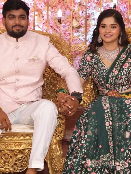A royal portrait of the couple on their engagement day. Her dark green floral lehenga is beautifully contrasted with a soft, dewy makeup look and diamond jewellery.