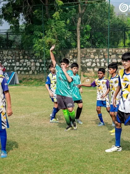 Players celebrating a goal during a match between GSC and MVTFA.