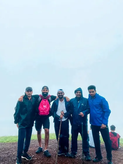 A proud team moment on the misty hills of Kodachadri. I guide groups through these mystical landscapes for an unforgettable offsite adventure.