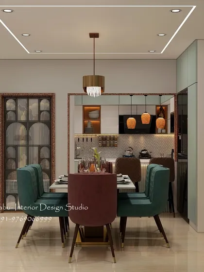 This dining space is designed for a modern family, featuring plush, colorful chairs and a sleek marble-top table. The square-patterned false ceiling with profile lighting adds a contemporary geometric element to the room.