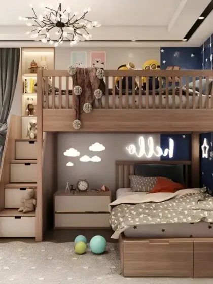 A celestial-themed bunk bed design with star-shaped lights and a deep blue accent wall. The stairs have built-in drawers, and the space under the loft can be used as a cozy reading or play area.