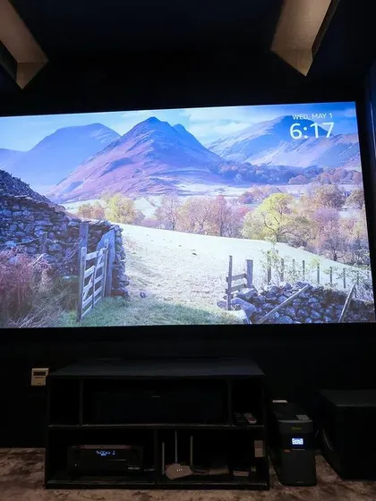 A duplicate of 129, this shot of the front of the room highlights the high-quality screen and the neatly organized AV components.
