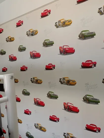 A fun wallpaper featuring characters from the movie 'Cars'. The repeating pattern is great for a young child's bedroom.