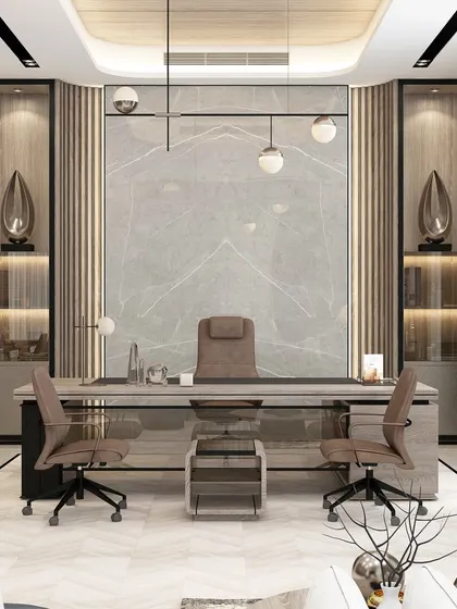 We design executive office spaces that command respect and foster productivity. This director's cabin features a balanced composition of marble, wood paneling, and ambient lighting, creating an environment of authority and refined taste for corporate leaders.