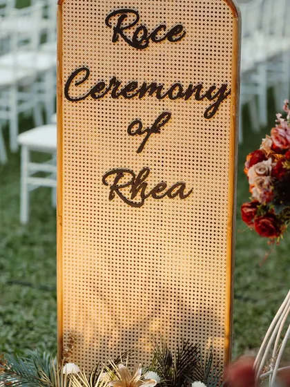 A chic and modern sign for a Roce ceremony. I used a trendy cane-work panel with elegant script to welcome guests, blending rustic texture with sophisticated design.