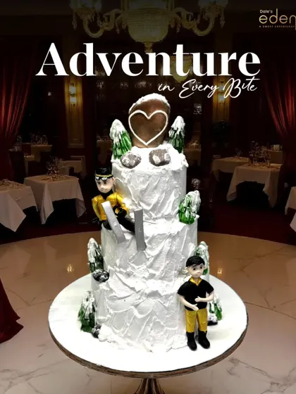 An adventure in every bite. This multi-tiered skiing-themed cake captures a winter wonderland with snowy slopes, frosted trees, and fondant skiers, bringing a cool vibe to any celebration.
