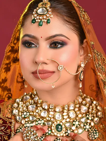 A close-up of a traditional bridal look by an MBM student. The dark kohl-rimmed eyes and matte nude lip are classic choices that you will learn to perfect.
