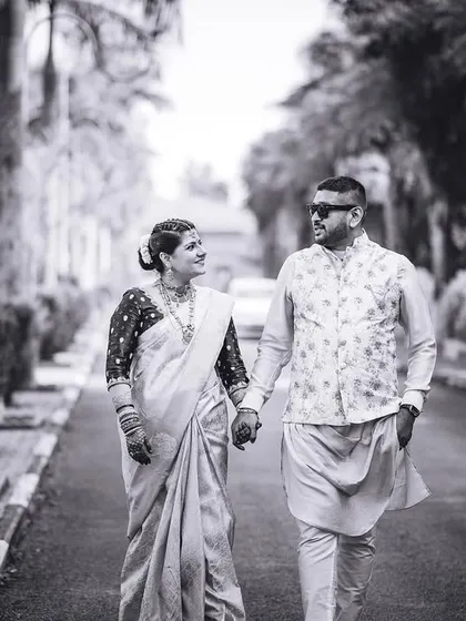 A fun, candid black and white shot of the couple walking hand-in-hand. We love capturing the "funtabulous" side of our couples' personalities.