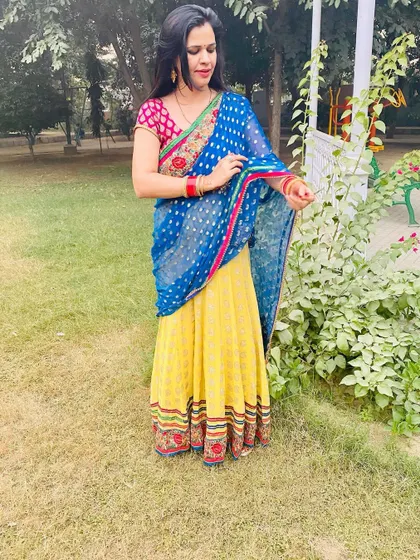 A throwback to this colorful lehenga-saree I wore. The combination of a yellow skirt and a blue embellished dupatta is so unique and perfect for a fun festive event like Sangeet or Mehendi.