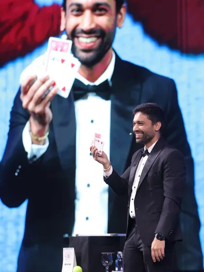 A successful card reveal during the Taj Hotels performance. The combination of my on-stage action and the larger-than-life version on the screen creates a powerful visual impact.