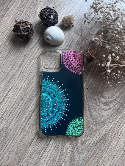 A custom phone case insert with colorful semi-mandalas.