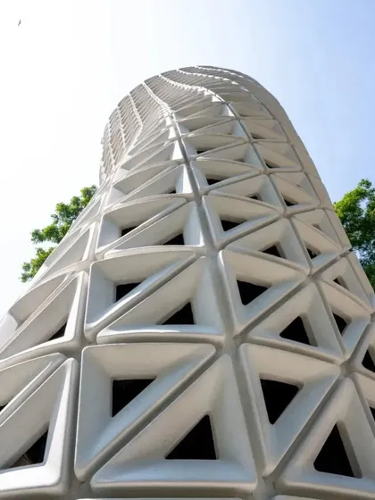 An upward-looking perspective of the VERTO tower, showcasing its dynamic, twisting geometry that is fundamental to its air-cleaning function.