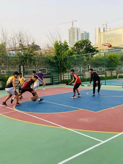 A player dribbles through traffic, demonstrating confidence and ball control.