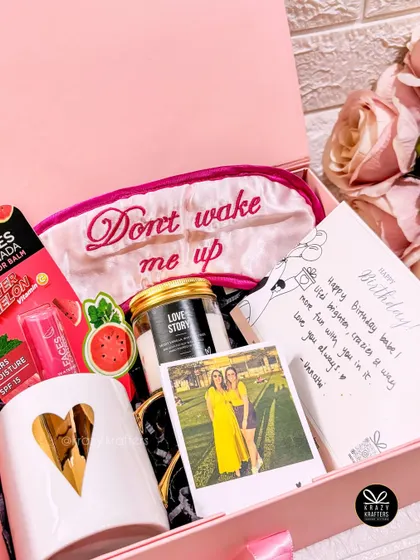 A pink-themed birthday hamper for a best friend, including a personalized card with a photo, a 'Don't wake me up' sleep mask, and watermelon-flavored treats.