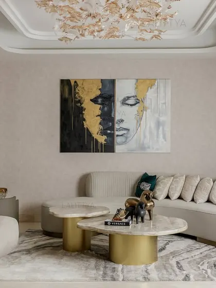 The living room at our Salcon Verandas project is imagined as a soft sculpture, crafted for conversation and comfort. From the curved seating to the textured ceiling and statement art, every piece was chosen with intent.