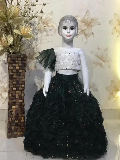 A stylish black and white set, featuring a skirt made of fabric roses and a white crop top.