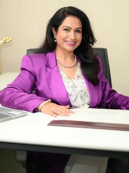 Branding portrait for an International Image Coach. The vibrant purple blazer and confident pose were chosen to reflect her personal brand and expertise in making a visual impact.