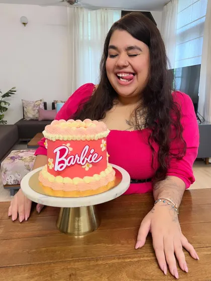 The Barbie fever is real. I had so much fun creating this vibrant pink and orange Barbie-themed cake, complete with retro-style piping. It's a fun and trendy design for any celebration.