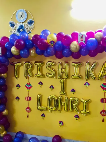 A simple yet beautiful home decoration for Trishika's first Lohri. I used foil letter balloons to spell out the message and a colorful balloon arch to frame it.