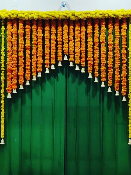 A simple yet beautiful way to decorate for a festival. This marigold toran with bells instantly adds a traditional and festive feel to any space.