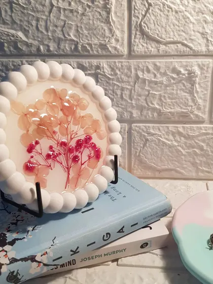 Another view of the floral resin bubble tray on its stand. This piece is a true conversation starter and a testament to our love for creative exploration.