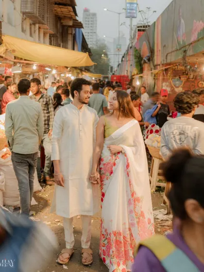 Hand in hand, navigating the bustling Dadar flower market. This candid pre-wedding photo captures an authentic slice of Mumbai life.