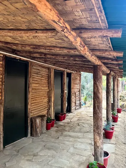 The wooden porch of our campsite rooms. It's a great spot to sit and relax, surrounded by the sights and sounds of the forest, before or after your ride.