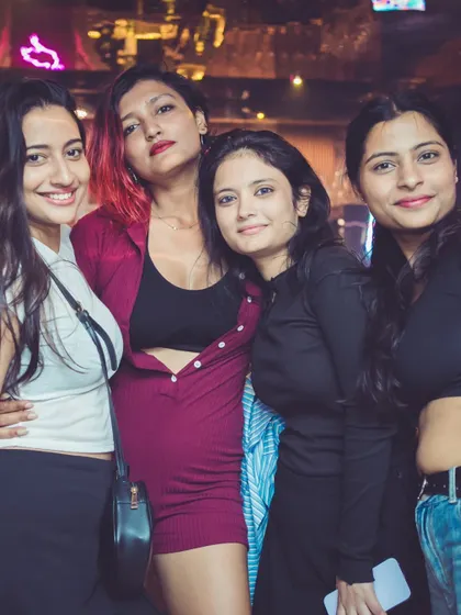 A group of ladies posing for a picture.