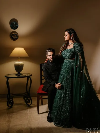 An elegant, posed portrait of the couple during their reception. The classic lighting and their sophisticated attire create a timeless and glamorous image.