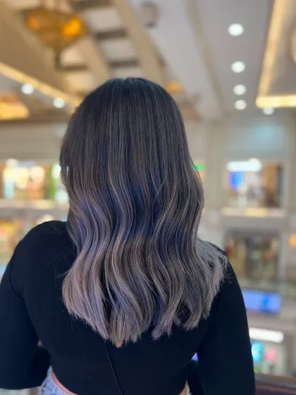 A beautiful ash balayage with cool, silvery tones that create a sophisticated and modern look. The color blends effortlessly with various skin tones.