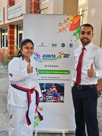 Posing with one of our medal winners at the Khelo India Women's Kickboxing League. Our girls demonstrated exceptional strength and resilience, bringing home multiple medals.