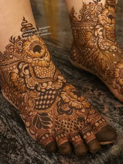 A close up of a detailed bridal foot design, showcasing the fine lines and complex patterns.