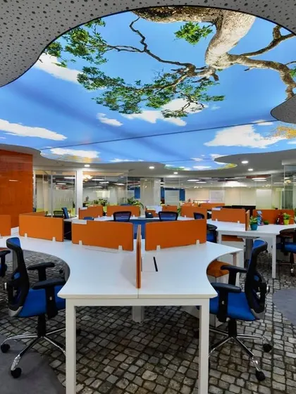 Imagine working under an open sky every day. We used a custom stretch-lit ceiling to create this stunning effect in an open-plan office, transforming the workspace and boosting creativity.