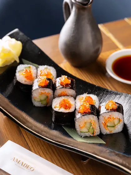 A serving of spicy tuna maki rolls. The simple, clean composition makes this image perfect for a menu or online ordering platform.
