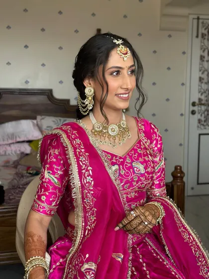 A candid shot showing her beautiful smile. The makeup is designed to look fresh and radiant throughout the long day of ceremonies.
