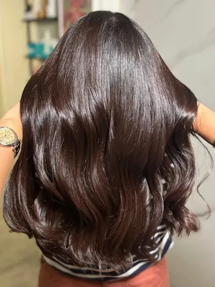 A back view of the glossy dark hair, showing its health and shine.