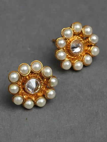 Classic pearl and kundan studs, perfect for an elegant and timeless look.