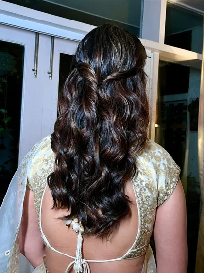 A perfect bridesmaid look. Neutrals for the eyes, a glossy nude lip, and a sheer, radiant complexion in a gold-ivory lehenga.