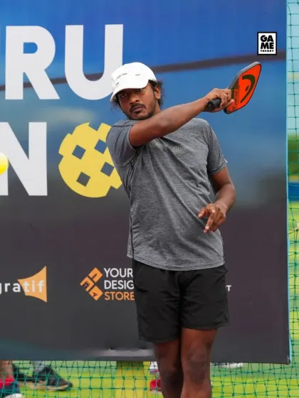 A player prepares to hit a forehand shot, showcasing the technique and skill on display at the B'luru Open Pickleball Tournament.